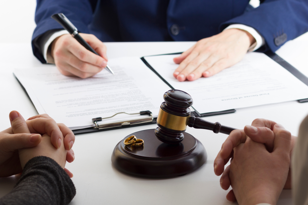 A couple filing for divorce in court.