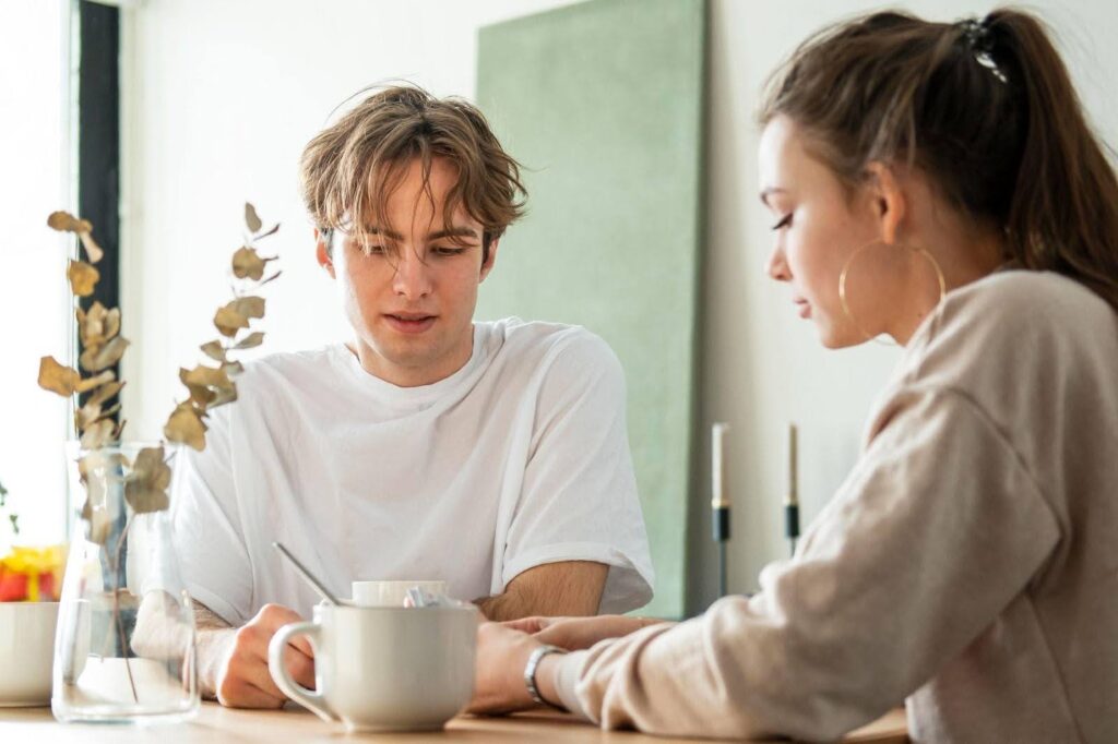 Young couple discussing a prenuptial agreement.